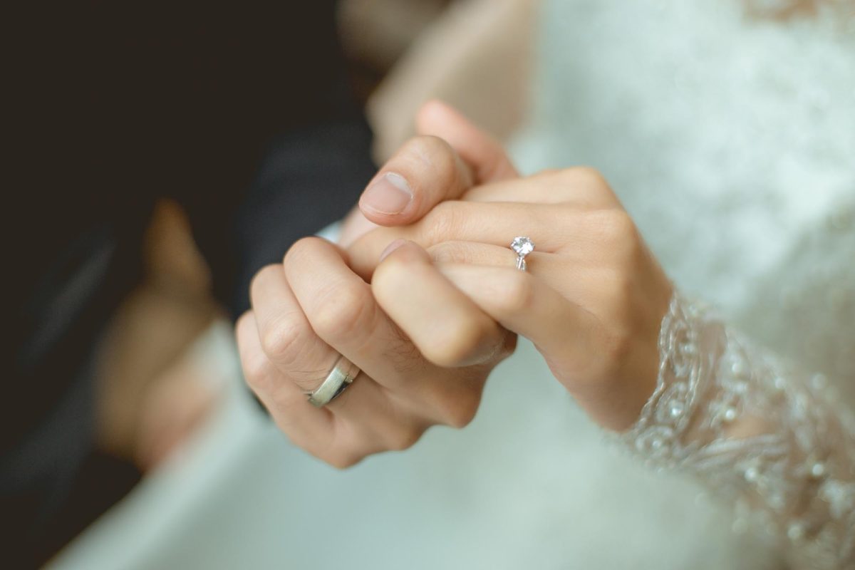 the-couple-holding-hands-together-they-had-a-wedding-rings-wear